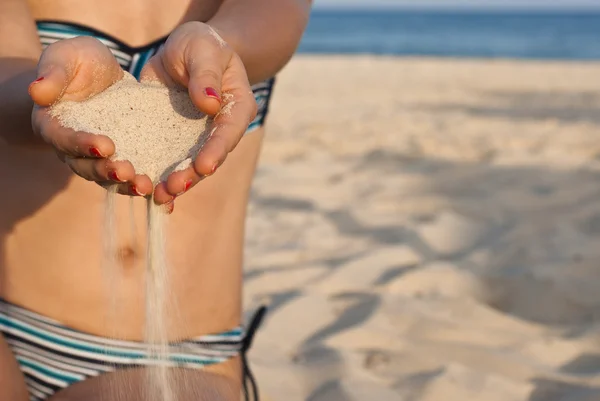 Hands with sand — Stock Photo, Image