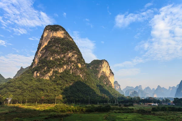 Sunrise over valley of limestone hills — Stock Photo, Image