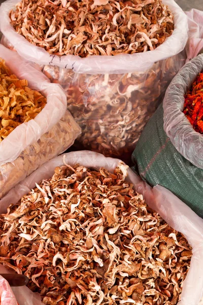 Dried mushrooms in big bags — Stock Photo, Image