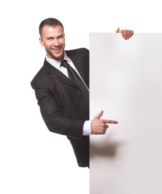 Businessman holding blank billboard clipart
