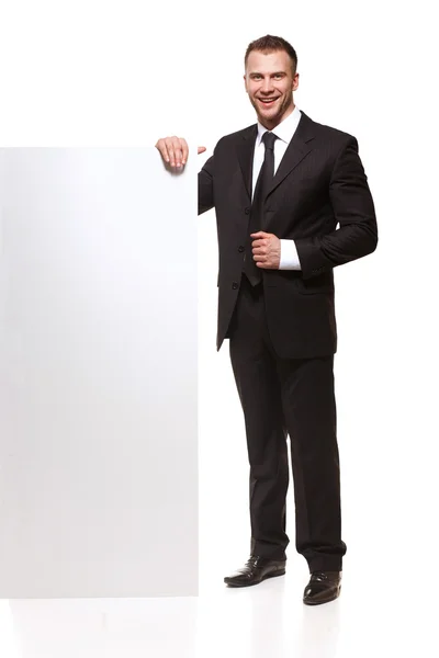 Porträt eines Geschäftsmannes mit leerem Schild — Stockfoto