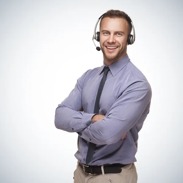 Smiling man wearing a headset Royalty Free Stock Photos