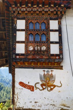 Facade of a Bhutanese building with a penis painting for fertility on the wall, Paro, Western Bhutan, Asia