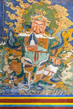 Manastır, Butan, Asya 'daki bir Budist Guru Rinpoche' un renkli duvar resmi.