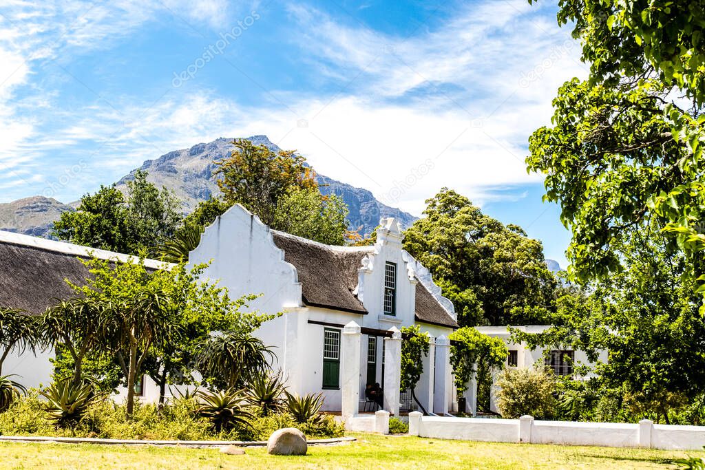 Exterior of an old white house in the style of the Dutch Cape architecture in Stellenbosch, Western Cape, South Africa, Africa