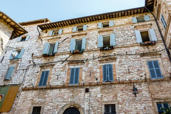 Facade of an old building in the historic center of Assisi, Umbria, Italy, Europe