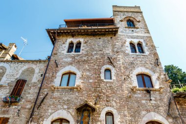 Facade of an old building in the historic center of Assisi, Umbria, Italy, Europe