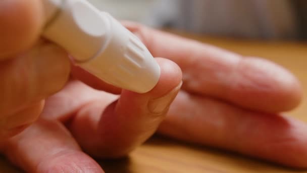 Close up. Man hand measuring diabetic on table. — Stock Video