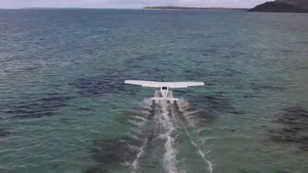 Aerial view. White hydroplane takeoff in a calm lagoon — Video Stock