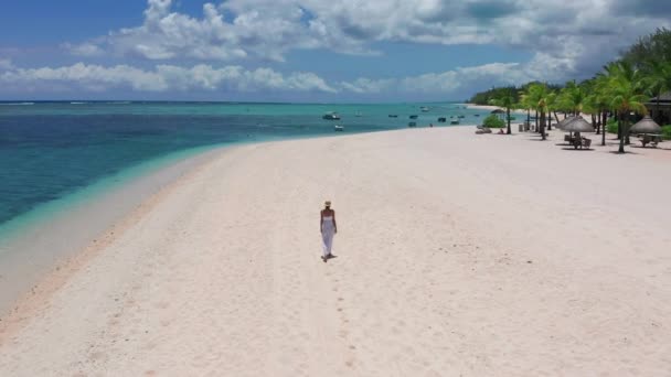 Girl walking on a white sand beach on a tropical island in the Mauritius Indian ocean — Stock Video