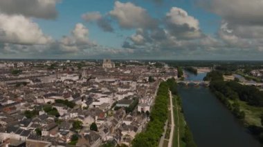 Aerial view of Paris suburb French city of Orleans. Roofs of medieval houses of the historical city. City center with beautiful houses and a church. High quality 4k footage
