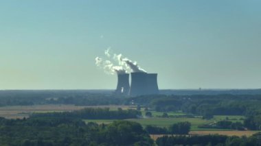 Aerial view to nuclear power plant in France. Atomic power stations are very important sources of electricity with low carbon footprint. Aerial view to big source of emissions in European Union.