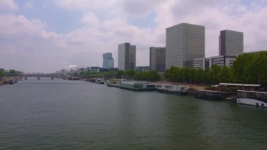Paris, France, 26 july, 2022: People and cars move along the wide streets of Paris. Weekend, summer, sunny, hot day in the capital of France. Most popular tourist landmark in France. 4k footage