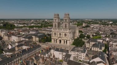Aerial view of Paris suburb French city of Orleans. Roofs of medieval houses of the historical city. City center with beautiful houses and a church. High quality 4k footage