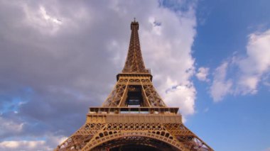 Timelapse, movement of clouds. Sunset, dusk, Eiffel tower, blue sky, top view, paris, 4k, time lapse, France. The most popular tourist attraction in the world. High quality 4k footage