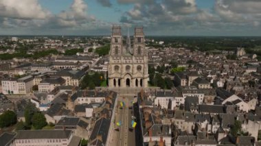 Aerial view of Paris suburb French city of Orleans. Roofs of medieval houses of the historical city. City center with beautiful houses and a church. High quality 4k footage