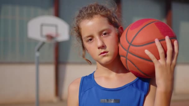 Boy Standing Basketball Court Holding Basketball His Arm Video Back — Vídeos de Stock
