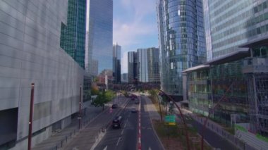 Skyscrapers of Defense timelapse hyperlapse modern business and financial district in Paris with high rise buildings and convention center. Blue cloudy sky in summer day. Reflections. 4k footage