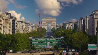Timelapse of Paris cityscape, Arch De Triumph on Champs Elysees in Paris and the traffic, the most famous landmark in Paris, France. Sunny day in summer with green leaves. High quality 4k footage