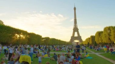 Eiffel tower, Paris, France, timelapse. Champ de Mars and the Eiffel Tower timelapse in a sunny summer day. Paris, France. High quality 4k footage