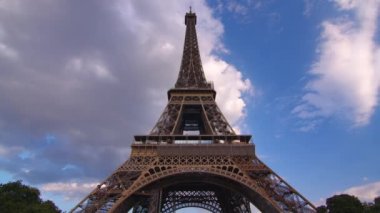 Timelapse, movement of clouds. Sunset, dusk, Eiffel tower, blue sky, top view, paris, 4k, time lapse, France. The most popular tourist attraction in the world. High quality 4k footage