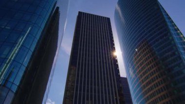 Business district building with blue sky and sun flare, France. High quality 4k footage