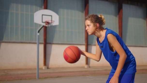 Active Male Basketball Player Practicing Ball Handling Skill Dribbling Ball — Stockvideo