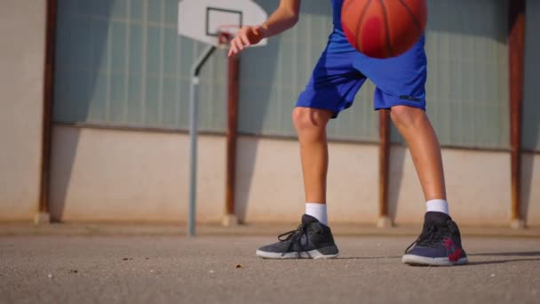 Active Male Basketball Player Practicing Ball Handling Skill Dribbling Ball — Video Stock