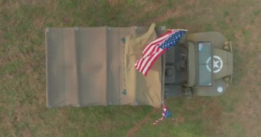 American military truck. American flag on military equipment. USA military equipment at the exhibition of old army weapons of the 20th century. High quality 4k footage