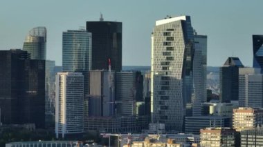 Aerial view of skyscrapers and buildings in the center of Paris at sunset. High quality 4k footage