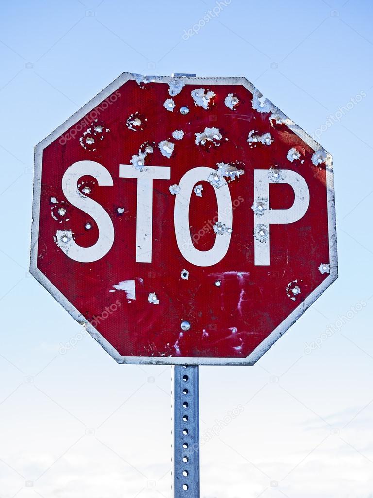 Stop Sign With Bullet Holes