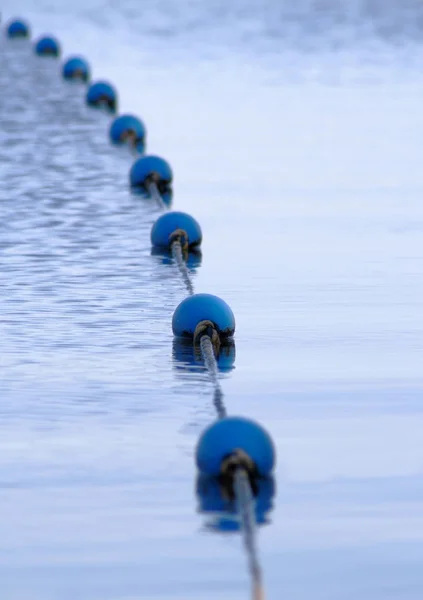 Boeien op blauwe meer — Stockfoto