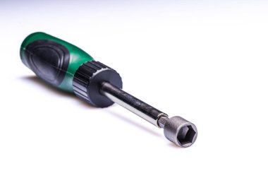 Interchangeable screwdriver set with different types of metal steel heads and bits, selective focus