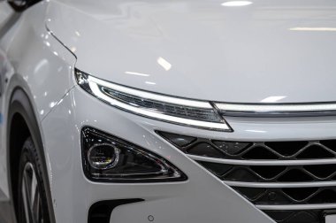 Riga, Latvia, April 29, 2022: LED headlights and car design closeup of nev Hyundai Nexo hydrogen fuel cell suv, model 2022