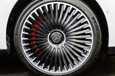Riga, Latvia, April 29, 2022: Close-up of Mercedes Benz EQS wheel, decorative new design alloy wheels