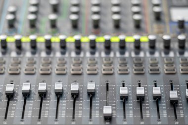 Sound and audio mixer control panel with buttons and sliders. Audio sound mixer console. close-up