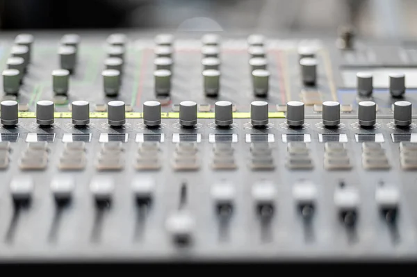 Sound and audio mixer control panel with buttons and sliders. Audio sound mixer console. close-up