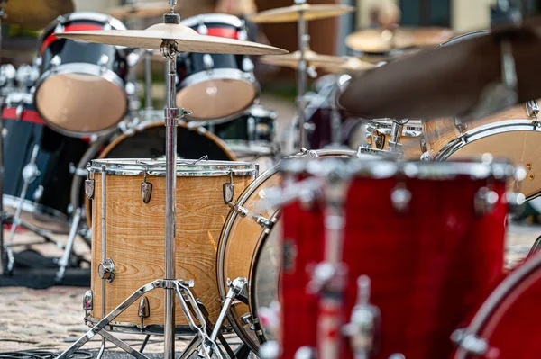 A set of plates in a drum set. At a concert of percussion music, selective focus, close-up
