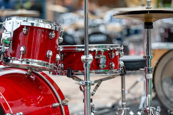 A set of plates in a drum set. At a concert of percussion music, selective focus, close-up