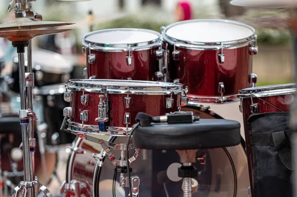 A set of plates in a drum set. At a concert of percussion music, selective focus, close-up