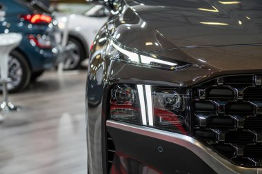 Riga, Latvia, April 29, 2022: LED headlights and car design closeup of nev Hyundai Santa Fe crossover, model 2022 clipart