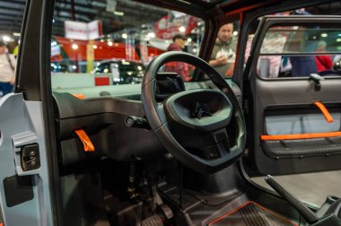 Riga, Latvia, April 29, 2022: Close-up of Citroen Ami electric car steering wheel and interior details design
