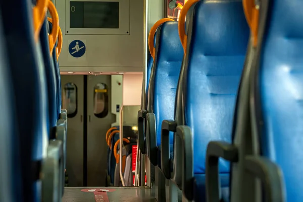 Italian railroad train interior, seats in a train in a row, train carriage with blue seats
