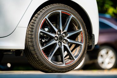 sports car wheels, low profile tires on aluminum rims, close-up, selective focus