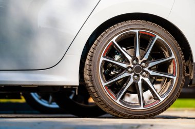 sports car wheels, low profile tires on aluminum rims, close-up, selective focus