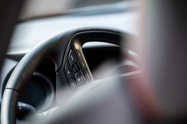 Interior view car with modern steering wheel, dashboard. Selective focus. Shallow depth of field