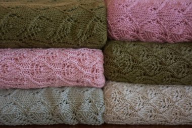 knitted fabric and blanket on background