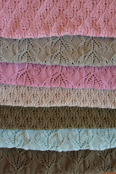 knitted fabric and blanket on background