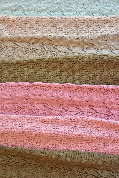 knitted fabric and blanket on background