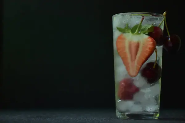 Drink Ice Cut Strawberries Cherries Served Glass Dark Background Copy — Stockfoto